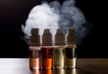 electronic cigarette, vaping device with e liquid background.